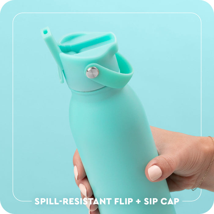 Spill-resistant Flip + Sip Cap with inner straw