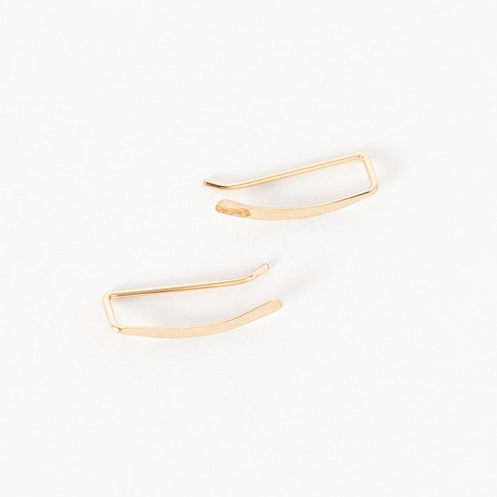 top view of the hammered sweep ear climbers in gold - crawlers - handmade in maine