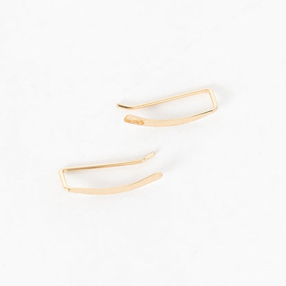 top view of the hammered sweep ear climbers in gold - crawlers - handmade in maine