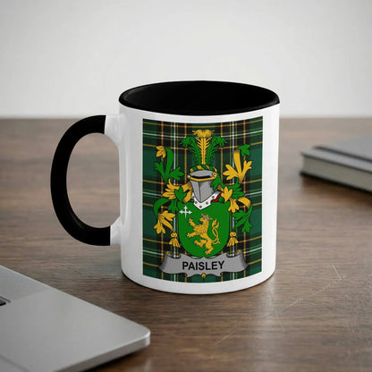 White mug with black handle featuring a green plaid design and the Paisley coat of arms.