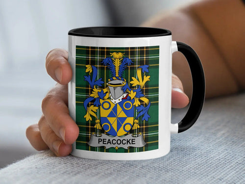 Peacocke Irish family crest black accent mug with Irish National Tartan