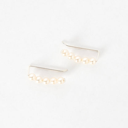 top view of the ivory pearl ear climbers - handmade in maine - jewelry - elegant earrings