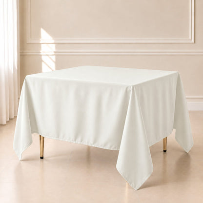 ivory polyester square table overlay on a table