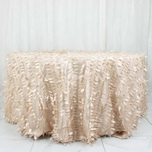 Beige tablecloth with leaf design on a round table.