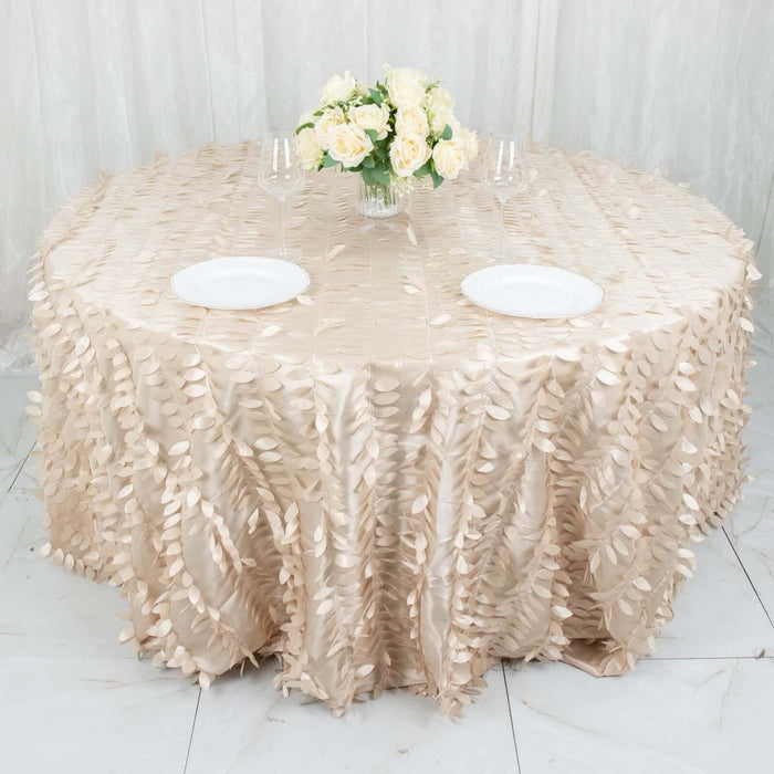 Elegant round table with a textured beige tablecloth and floral centerpiece.