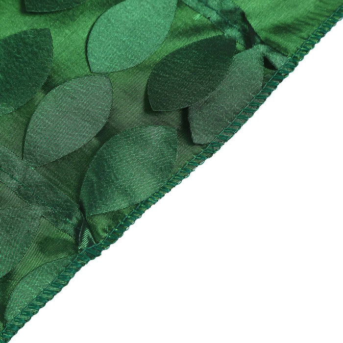 Green fabric with leaf-shaped embellishments, showcasing texture and detail. #whtbkgd