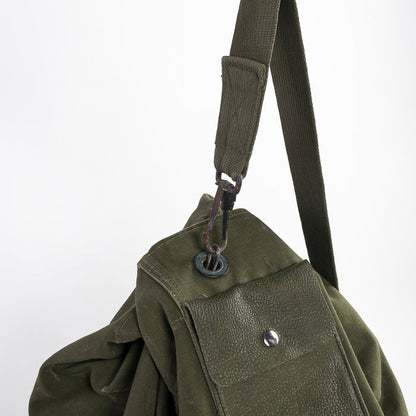 shoulder strap and metal clip closure on the vintage Army duffle - green canvas - leather - US